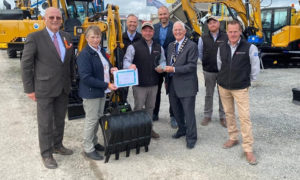 Sleator Plant staff celebrate their award for Best Trade Stand in the Other Equipment & Vehicles category at the 2021 Balmoral Show