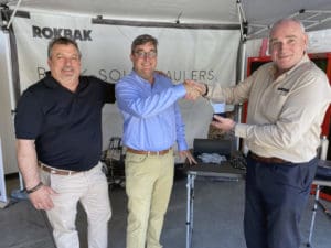 From left: Kevin Clark, Rokbak Regional Sales Manager, Jim Hills, Co-founder and President of Hills Machinery, and Guy Wilson, Rokbak Global Sales Director.